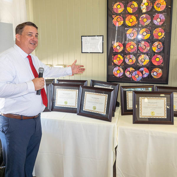 Shawn O’Briant with framed certificates