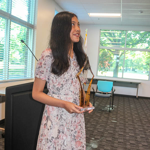 Saffiya Sheikh holding trophy