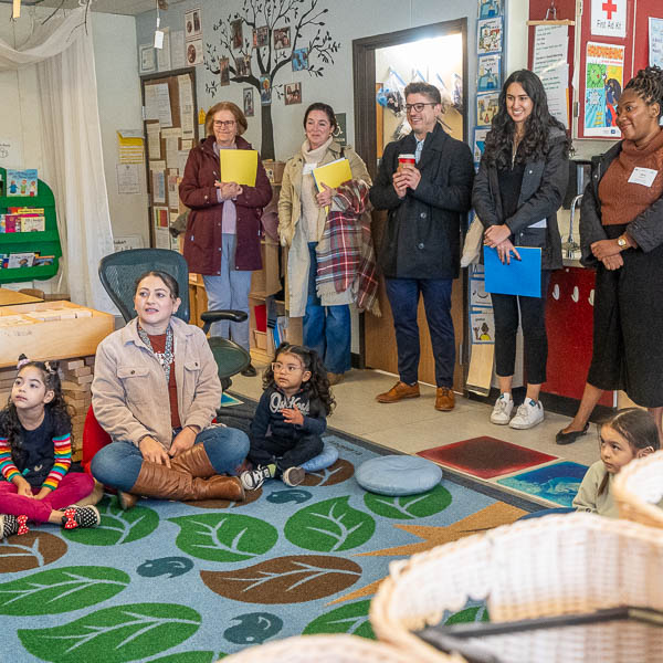 Visitors observing children in the classroom