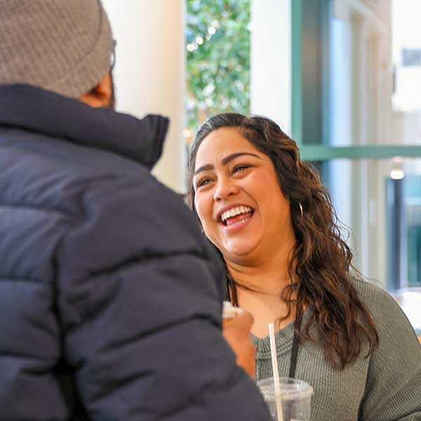 Attendee laughing