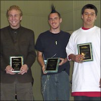 Students holding plaques