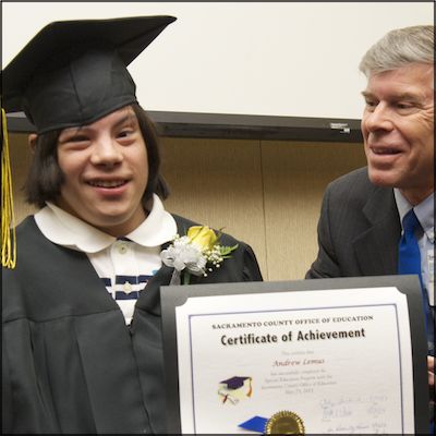 Greg Geeting with student holding certificate