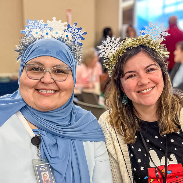 Staff wearing snowflake head gear