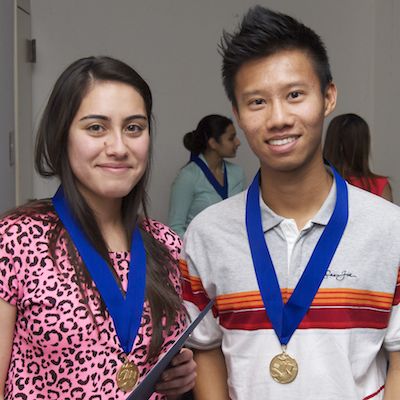 Scholarship recipients wearing medals