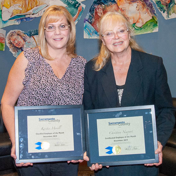 Kerstin Morell and Christina Newport holding plaques