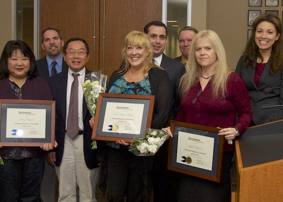 Cindy Tanaka, Heidi Bremen-Schmitz , and Renee Mauricio receiving certificates
