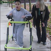 Instructor with student using assistive device