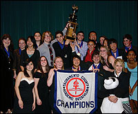 Folsom High School group photo with champions banner and trophy