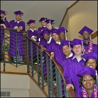 Graduates posing on stairs