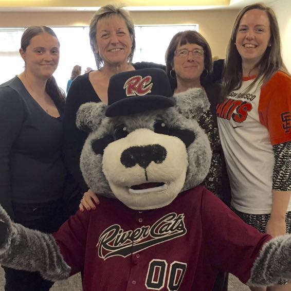Staff posing with River Cats mascot