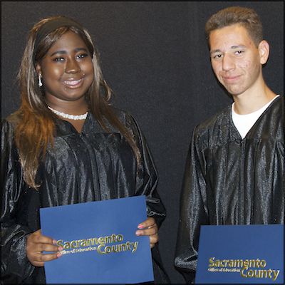 Students holding High School Equivalency Certificates
