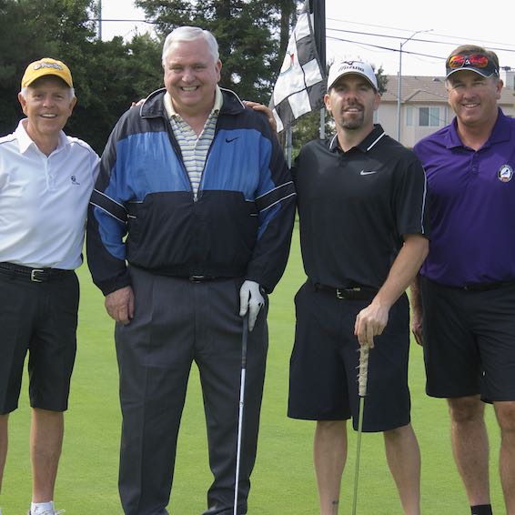 Superintendent Gordon posing with golf team