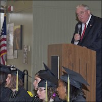 Superintendent addressing graduates