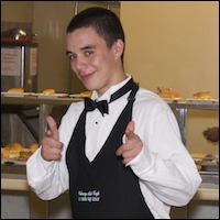 Student server flashing a smile while making a silly gesture