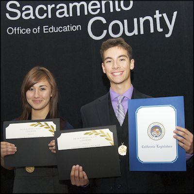 Students holding certificates