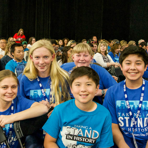 Group of student competitors wearing blue History Day t-shirts