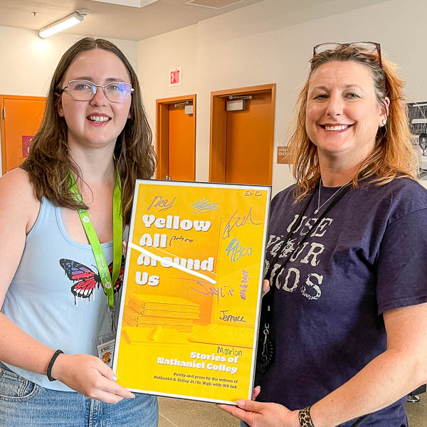 Sarah Potter and Jennifer Leeper holding an enlarged copy of the book cover