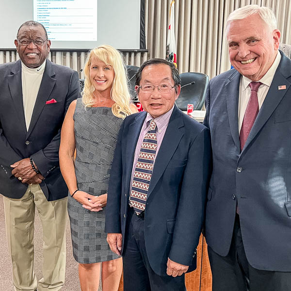 Al Brown, Heather Davis, and Harold Fong with Superintendent Gordon