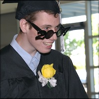 Graduate wearing 2007-shaped glasses
