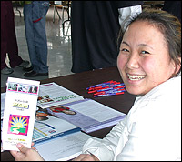Representative holds up brochure