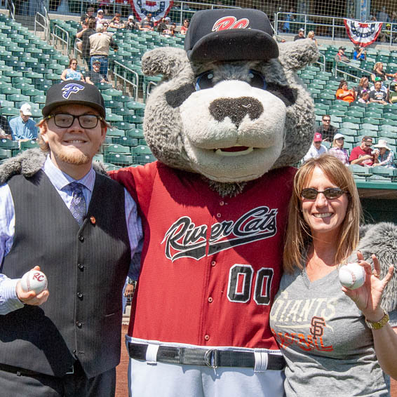 Michael Steele and Julie Harms posing with the River Cats mascot