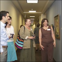 Employees looking at artwork