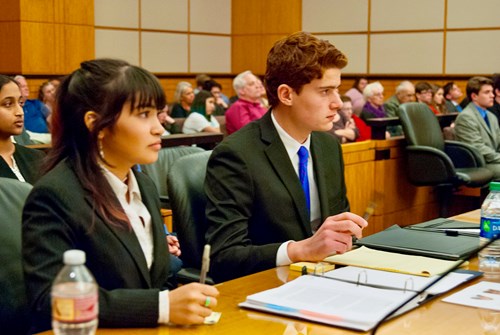 Student attorneys sit during mock trial round.
