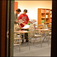 Parent and student seen through open classroom door