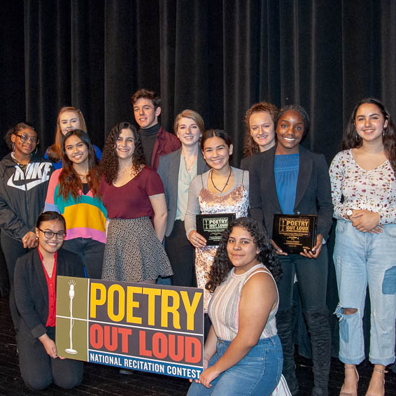 Poetry Out Loud participants posing with sign