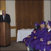 David Gordon speaking to graduates