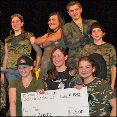 Arcohe second place team posing with $75 check from the Coca-Cola Bottling Company
