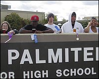 Students behind Palmiter sign