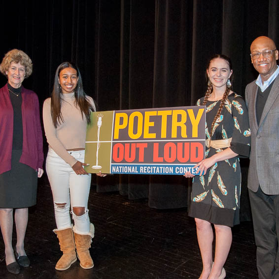 Poetry Out Loud winner and runner-up posing with sign