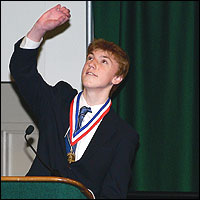 Zachary Windheim gestures while delivering speech